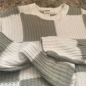 Cropped green and white checkered sweater.